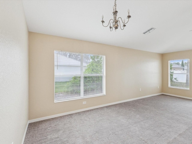 5048 Teather St, Spring Hill, FL 34608 - carpeted empty room featuring a chandelier and baseboards