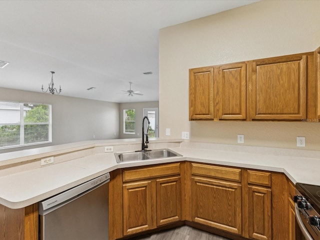 5048 Teather St, Spring Hill, FL 34608 - kitchen with stainless steel appliances, brown cabinets, and healthy amount of natural light