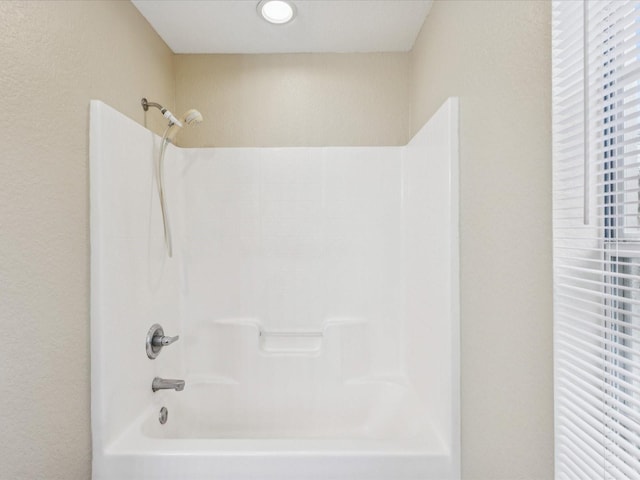 5048 Teather St, Spring Hill, FL 34608 - bathroom with bathing tub / shower combination and a textured wall
