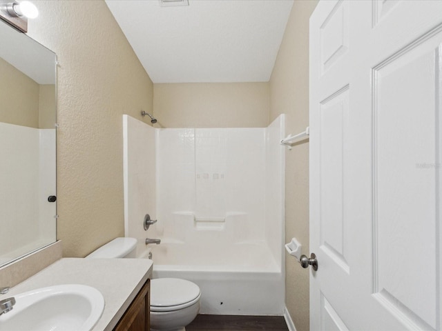 5048 Teather St, Spring Hill, FL 34608 - full bathroom featuring a textured wall, vanity, shower / washtub combination, and wood finished floors