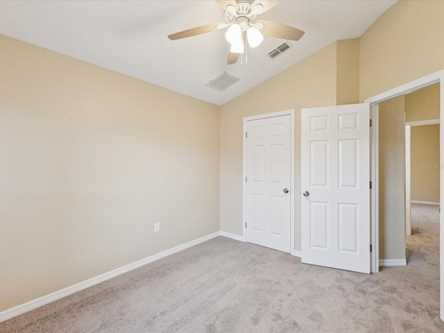 5048 Teather St, Spring Hill, FL 34608 - unfurnished bedroom with carpet flooring, vaulted ceiling, and a ceiling fan