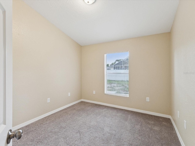 5048 Teather St, Spring Hill, FL 34608 - carpeted empty room with baseboards