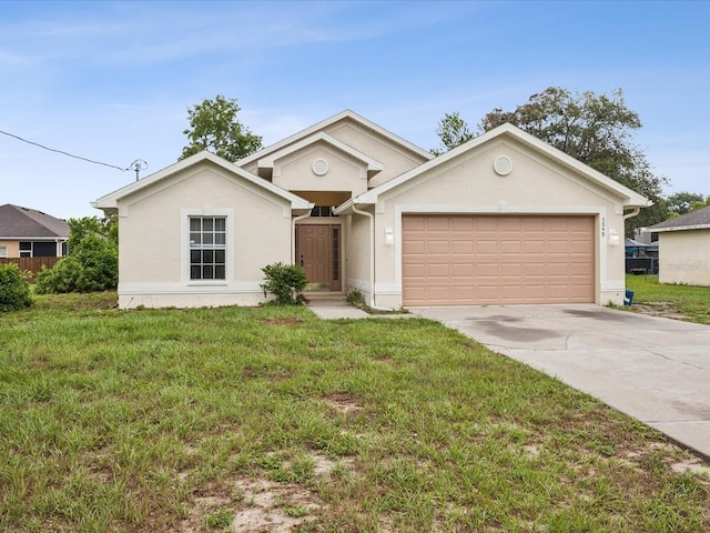 5048 Teather St, Spring Hill, FL 34608 - view of front of property with a garage, driveway, stucco siding, and a front lawn