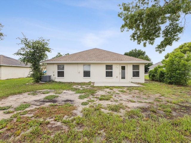 5048 Teather St, Spring Hill, FL 34608 - rear view of house featuring stucco siding and a patio area