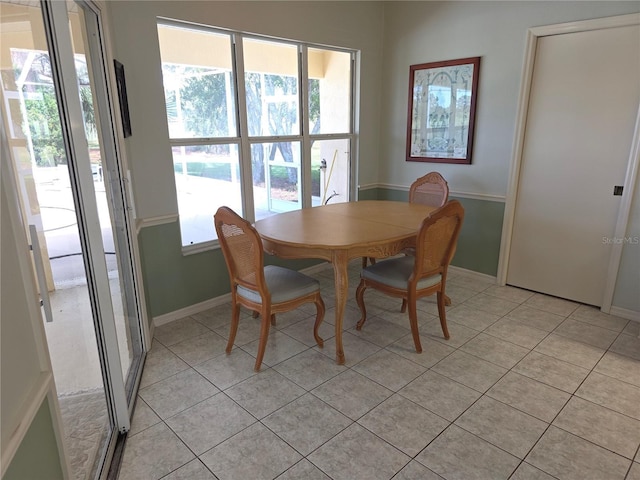 9168 Southern Comfort Ct, Weeki Wachee, FL 34613 - dining area featuring light tile patterned floors