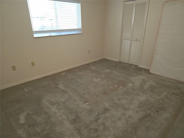 9168 Southern Comfort Ct, Weeki Wachee, FL 34613 - unfurnished bedroom featuring carpet flooring and a closet