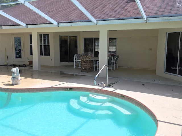 9168 Southern Comfort Ct, Weeki Wachee, FL 34613 - swimming pool with glass enclosure and a patio