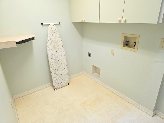 9168 Southern Comfort Ct, Weeki Wachee, FL 34613 - laundry area with hookup for an electric dryer, cabinet space, and hookup for a washing machine