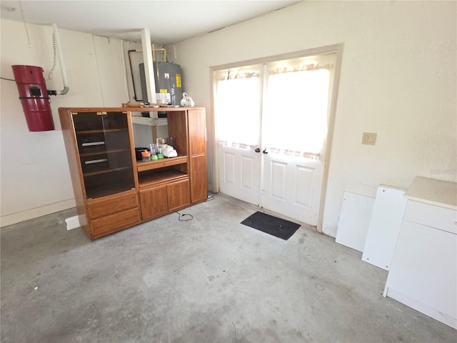 9168 Southern Comfort Ct, Weeki Wachee, FL 34613 - misc room with unfinished concrete flooring and water heater