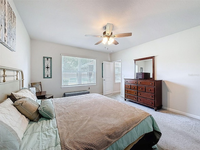 8855 Prairie Creek Dr, New Port Richey, FL 34655 - bedroom with light carpet and ceiling fan