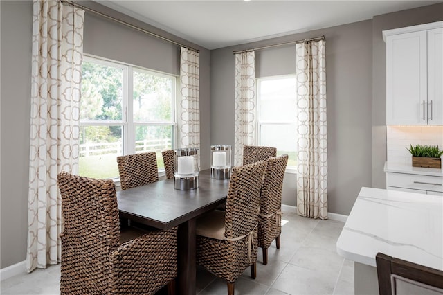 10816 SW 72nd Cir, Ocala, FL 34476 - dining room with light tile patterned floors