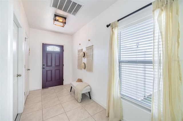 12119 Barnsley Reserve Pl, Gibsonton, FL 33534 - entryway featuring light tile patterned floors and baseboards