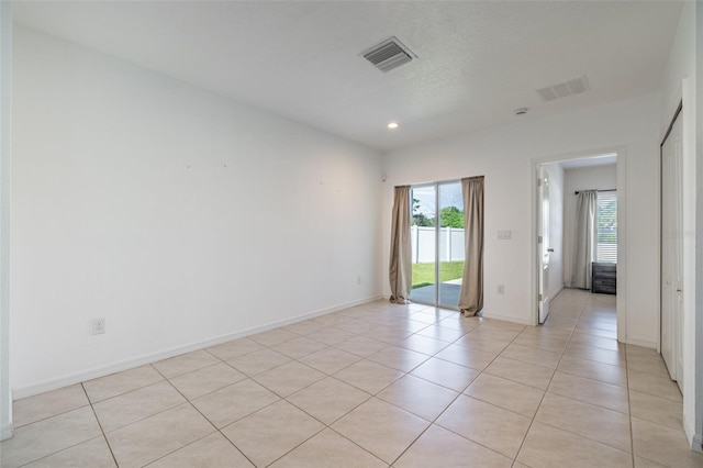 12119 Barnsley Reserve Pl, Gibsonton, FL 33534 - empty room with light tile patterned floors and recessed lighting