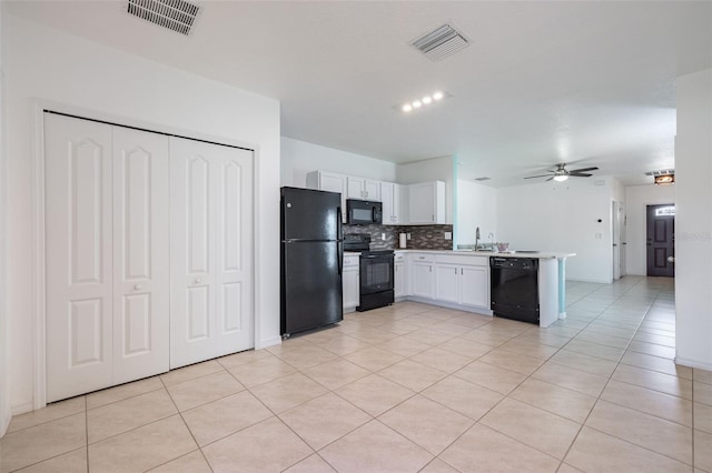12119 Barnsley Reserve Pl, Gibsonton, FL 33534 - kitchen with black appliances, a peninsula, a ceiling fan, light tile patterned floors, and backsplash