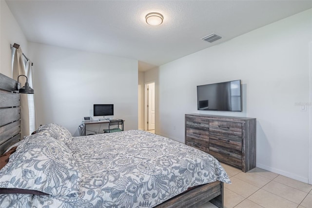 12119 Barnsley Reserve Pl, Gibsonton, FL 33534 - bedroom with baseboards and light tile patterned flooring