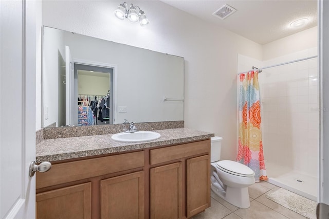 12119 Barnsley Reserve Pl, Gibsonton, FL 33534 - full bathroom with a shower stall, vanity, a spacious closet, and tile patterned floors
