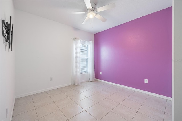 12119 Barnsley Reserve Pl, Gibsonton, FL 33534 - tiled spare room featuring ceiling fan and baseboards