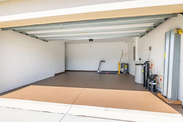 12119 Barnsley Reserve Pl, Gibsonton, FL 33534 - garage featuring electric water heater, a garage door opener, electric panel, and concrete block wall