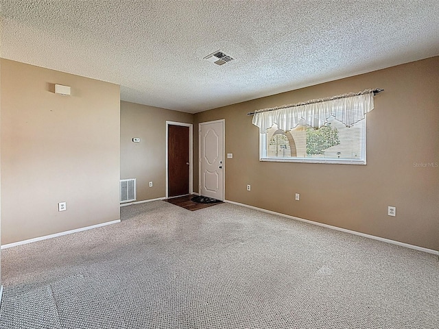 11094 Auburndale St, Spring Hill, FL 34609 - carpeted empty room with baseboards and a textured ceiling