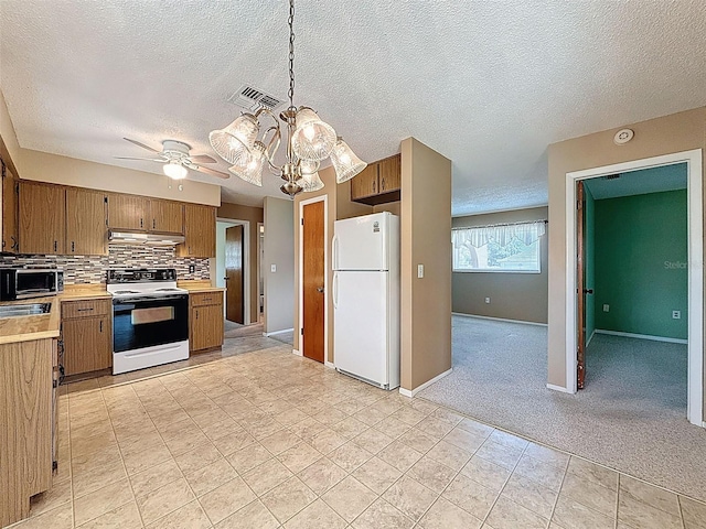 11094 Auburndale St, Spring Hill, FL 34609 - kitchen featuring white appliances, light countertops, backsplash, a chandelier, and light tile patterned flooring