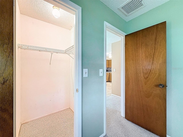 11094 Auburndale St, Spring Hill, FL 34609 - corridor with carpet and a textured ceiling