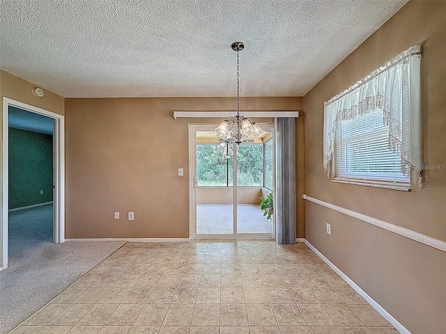 11094 Auburndale St, Spring Hill, FL 34609 - unfurnished dining area with a chandelier and a textured ceiling