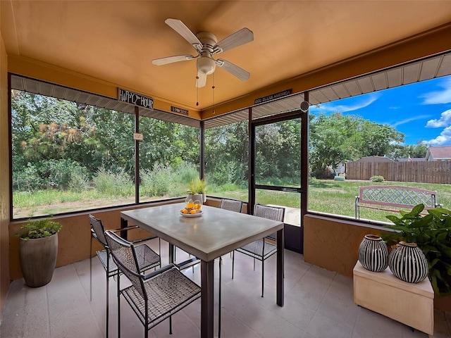 11094 Auburndale St, Spring Hill, FL 34609 - sunroom / solarium with ceiling fan and outdoor dining area