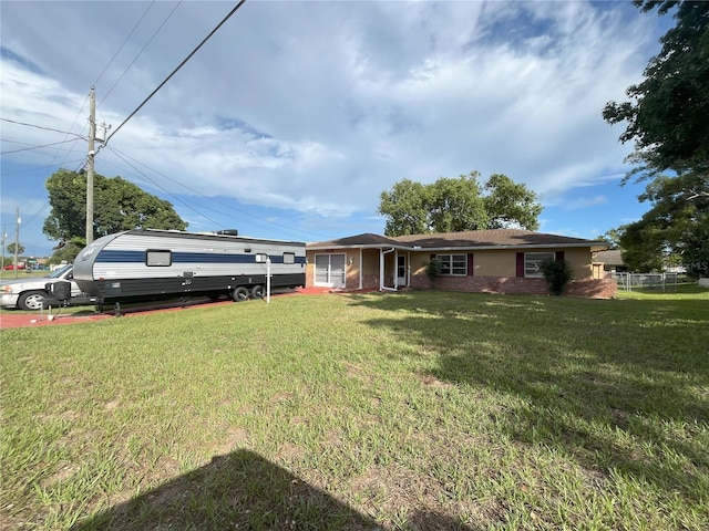 10458 Clingman St, Spring Hill, FL 34608 - view of front of house featuring a front lawn and brick siding