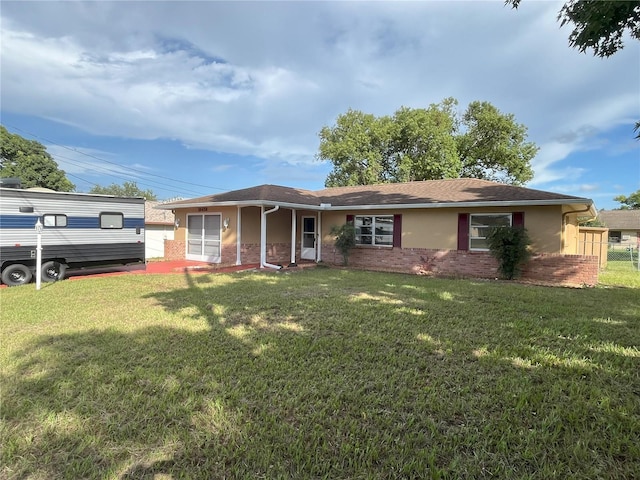 10458 Clingman St, Spring Hill, FL 34608 - single story home featuring brick siding, a front yard, and stucco siding