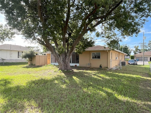 10458 Clingman St, Spring Hill, FL 34608 - back of house with stucco siding and a gate