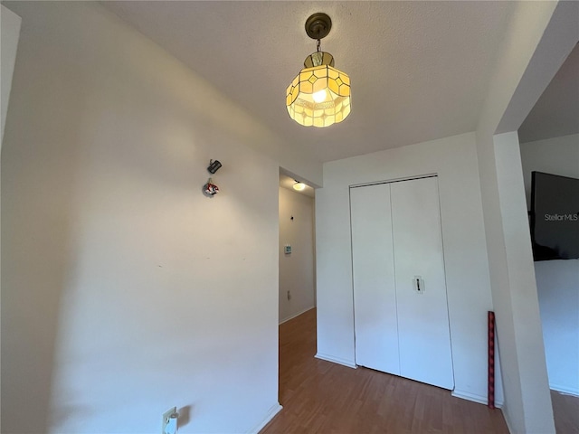 10458 Clingman St, Spring Hill, FL 34608 - unfurnished bedroom with wood finished floors and a closet