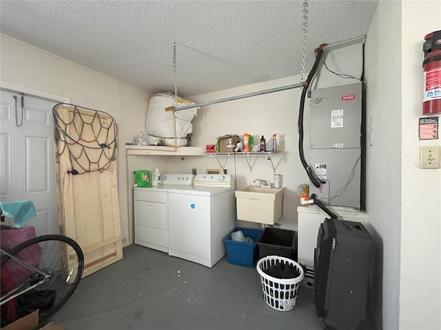 10458 Clingman St, Spring Hill, FL 34608 - laundry area with washing machine and dryer, a textured ceiling, and heating unit