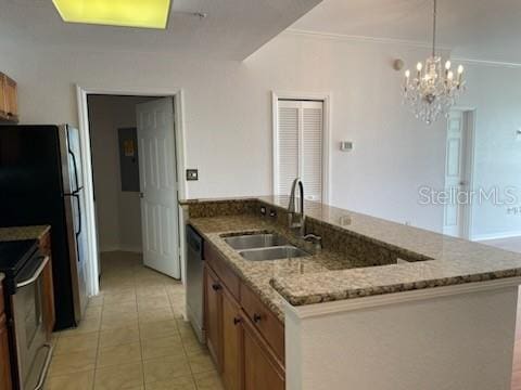 700 S Harbour Island Blvd Unit 407, Tampa, FL 33602 - kitchen with appliances with stainless steel finishes, light tile patterned floors, a chandelier, light stone countertops, and crown molding