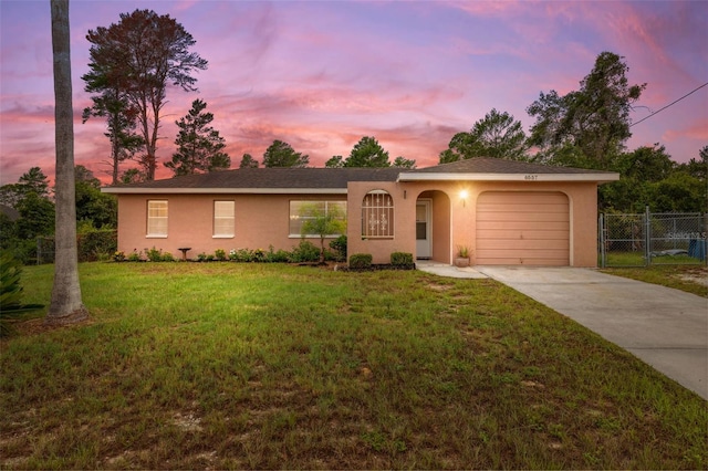 6557 Landover Blvd, Spring Hill, FL 34608 - single story home featuring driveway, an attached garage, and stucco siding
