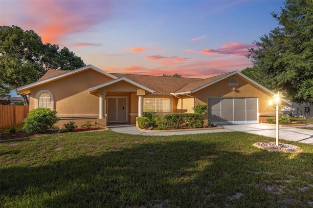 10394 Ireland St, Spring Hill, FL 34608 - ranch-style home featuring stucco siding, driveway, and a garage