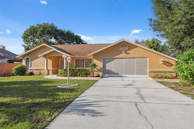 10394 Ireland St, Spring Hill, FL 34608 - ranch-style house featuring stucco siding, a garage, and driveway