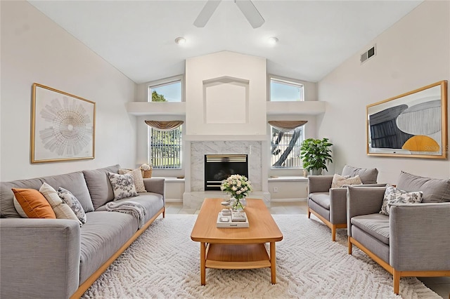 10394 Ireland St, Spring Hill, FL 34608 - living room featuring a ceiling fan, a premium fireplace, and high vaulted ceiling