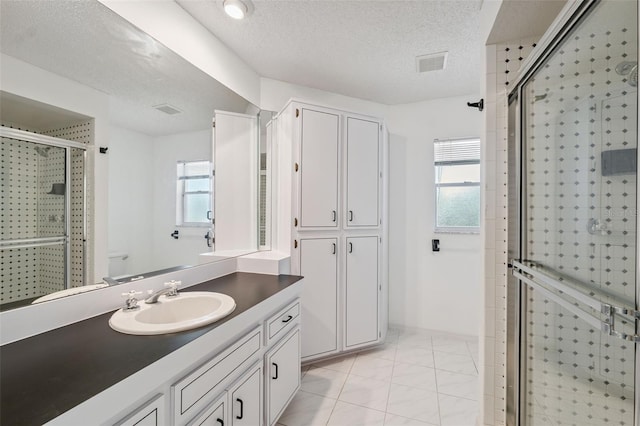 10394 Ireland St, Spring Hill, FL 34608 - full bath featuring vanity, a stall shower, a textured ceiling, and marble finish floors