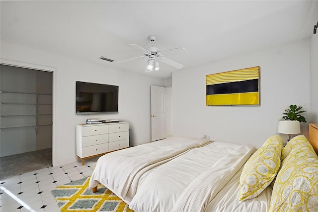 10394 Ireland St, Spring Hill, FL 34608 - bedroom featuring tile patterned floors, ceiling fan, a closet, and a spacious closet