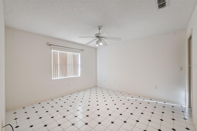 10394 Ireland St, Spring Hill, FL 34608 - empty room featuring a ceiling fan, a textured ceiling, and tile patterned floors