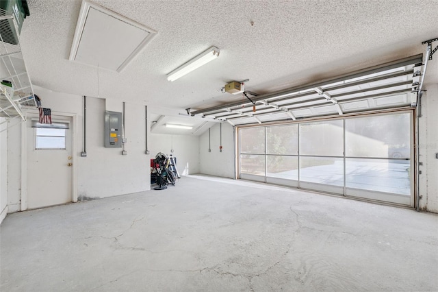 10394 Ireland St, Spring Hill, FL 34608 - garage featuring electric panel and a garage door opener