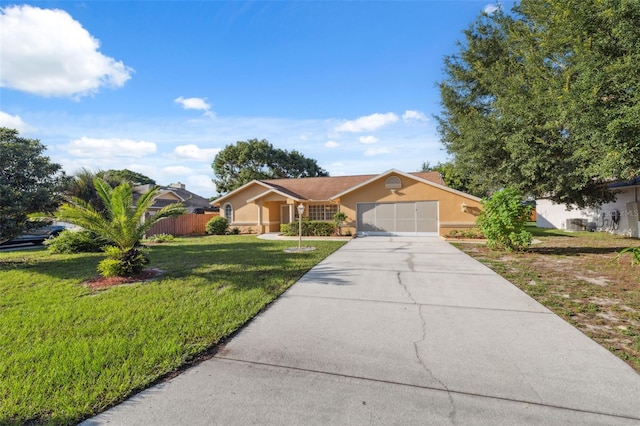 10394 Ireland St, Spring Hill, FL 34608 - ranch-style home featuring stucco siding, concrete driveway, and an attached garage