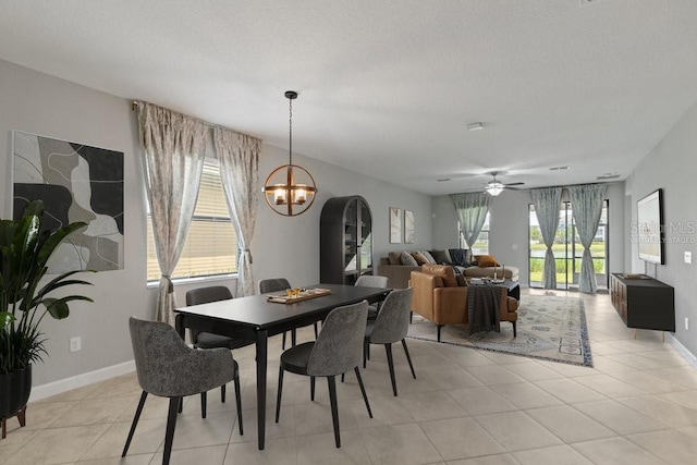 16874 Balance Cv, Land O Lakes, FL 34638 - dining area with a chandelier, healthy amount of natural light, and light tile patterned floors