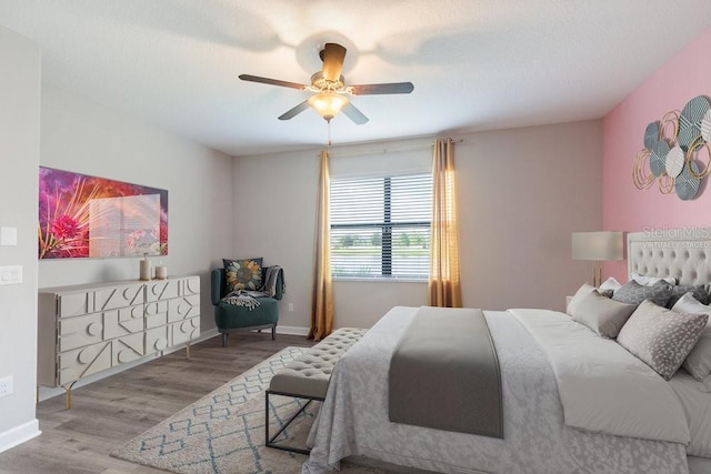 16874 Balance Cv, Land O Lakes, FL 34638 - bedroom featuring wood finished floors and a ceiling fan