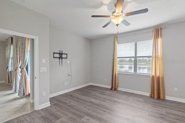 16874 Balance Cv, Land O Lakes, FL 34638 - unfurnished room with ceiling fan and wood finished floors