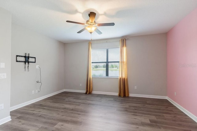 16874 Balance Cv, Land O Lakes, FL 34638 - empty room featuring a ceiling fan and wood finished floors