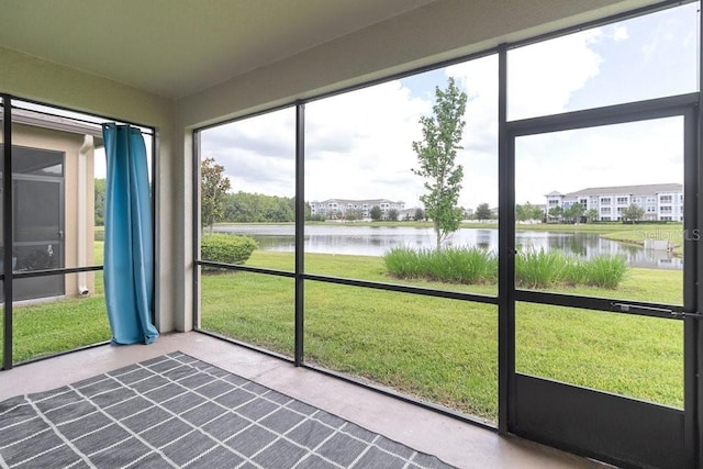 16874 Balance Cv, Land O Lakes, FL 34638 - unfurnished sunroom with a water view and plenty of natural light