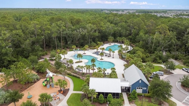 16874 Balance Cv, Land O Lakes, FL 34638 - bird's eye view of a heavily wooded area and a pool area
