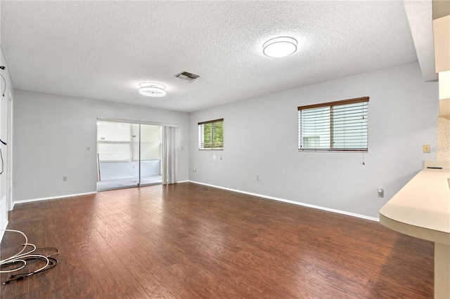 7700 Danube Dr Unit 7700, Hudson, FL 34667 - unfurnished room featuring a textured ceiling and wood finished floors