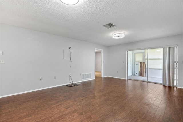 7700 Danube Dr Unit 7700, Hudson, FL 34667 - empty room with wood finished floors and a textured ceiling